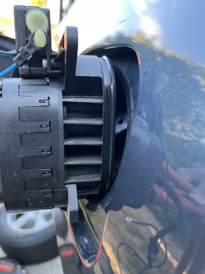 Taycan CCS1 socket held up to RAV4 EV Charge Port aperture