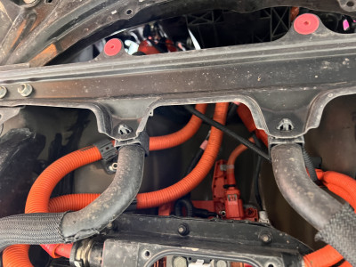 Looking straight up, in front of the HV battery