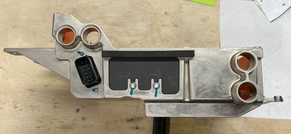 Tesla Model S GEN1 Rear HVJB: left side blanking plate, used when a Single OBC is installed.  Removed when a Second/Slave OBC is installed, which will use parked connectors behind this plate.