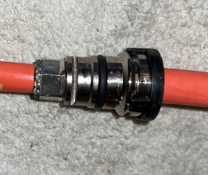 Tesla Model S LDU HV Cables' proprietary gland connector.